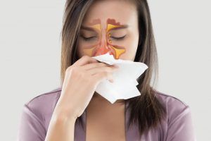 woman with sinuses plugged