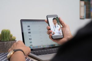 man on phone operating with doctor