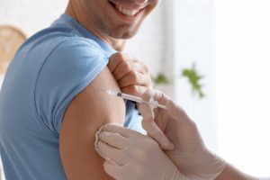 man getting a vaccination shot