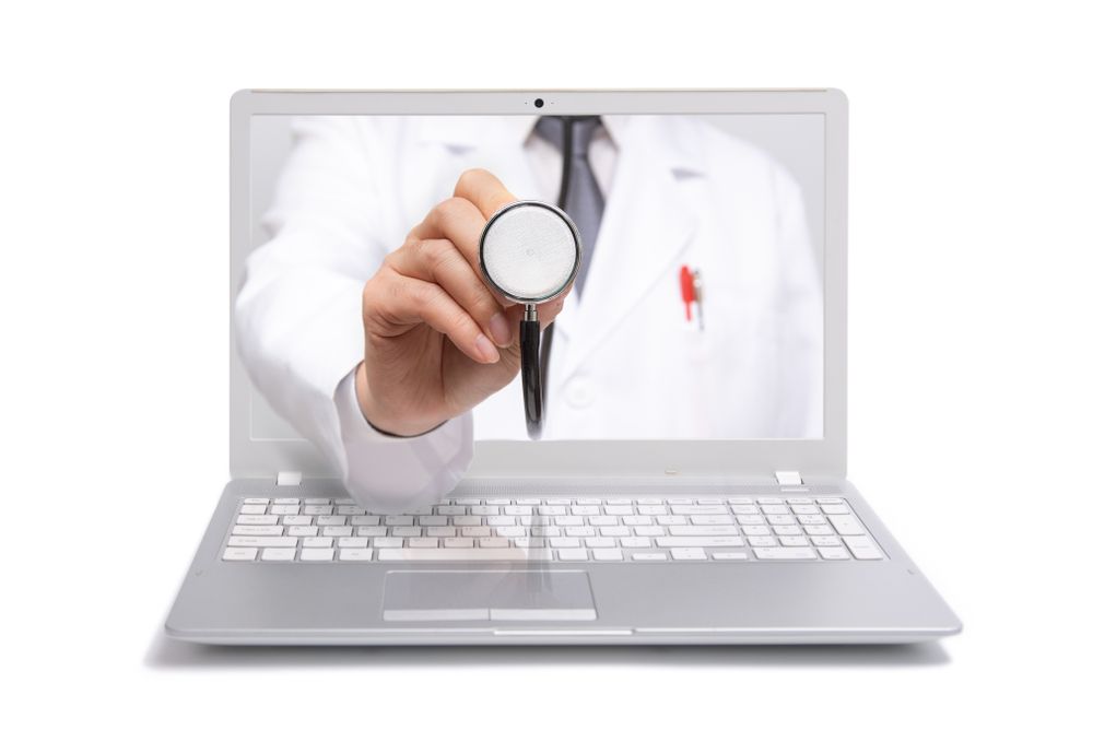 doctor in computer holding out stethoscope