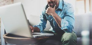 man in front of laptop