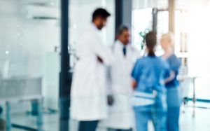 Defocused shot of a group of medical practitioners working in a hospital