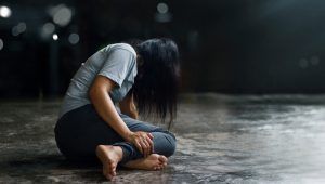 woman kneeling on floor
