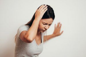woman suffering from dizziness